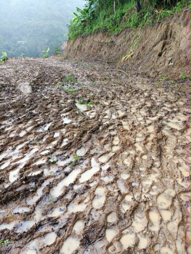 Muddy rural road in the Philippines after rain